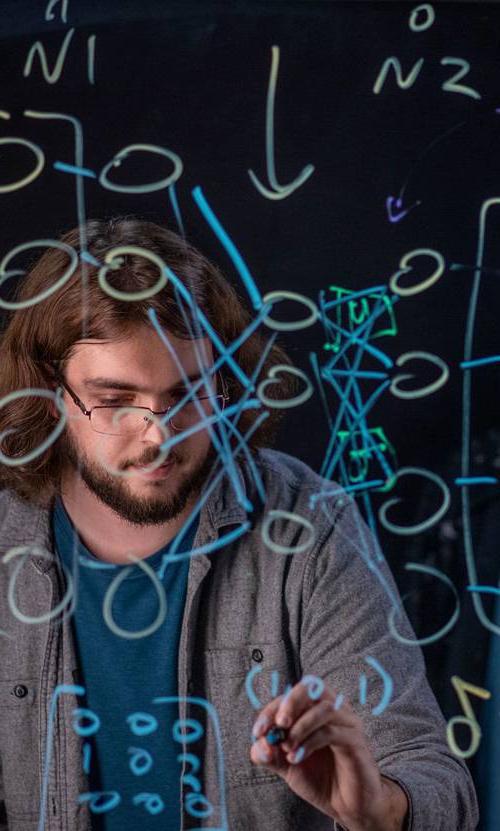 GVSU graduate student working in a technology lab.